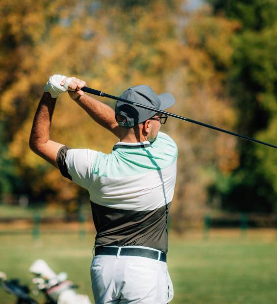 Golf couple, playing on the golf course